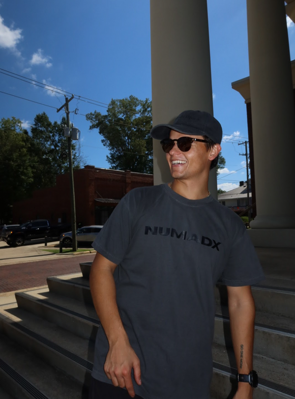 Man wearing Numax tonal tee in Numadx shoe inserts that improve comfort.